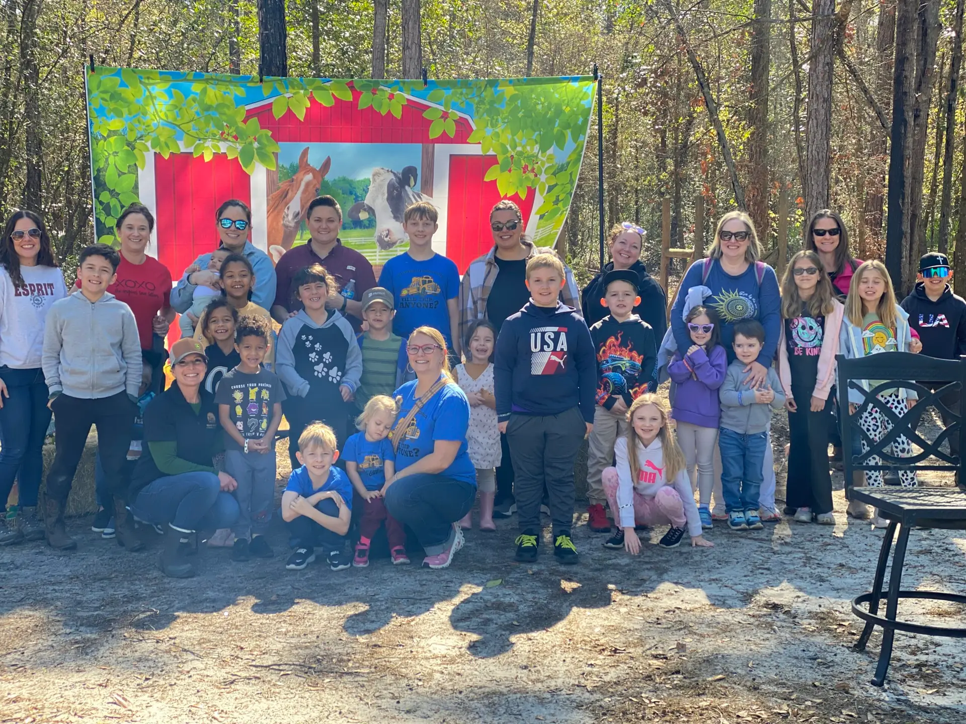 Families and children gathered at Healing Hooves Farm in Middleburg during a homeschool farm tour.
