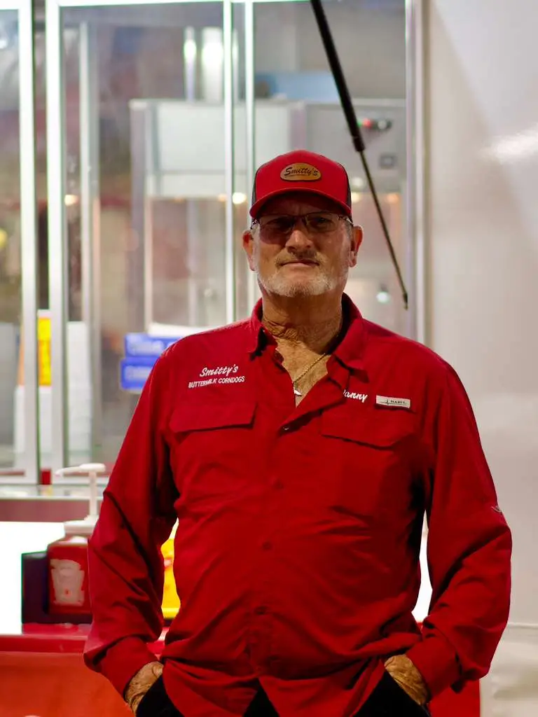 Owner of Smitty's corn dogs in red uniform