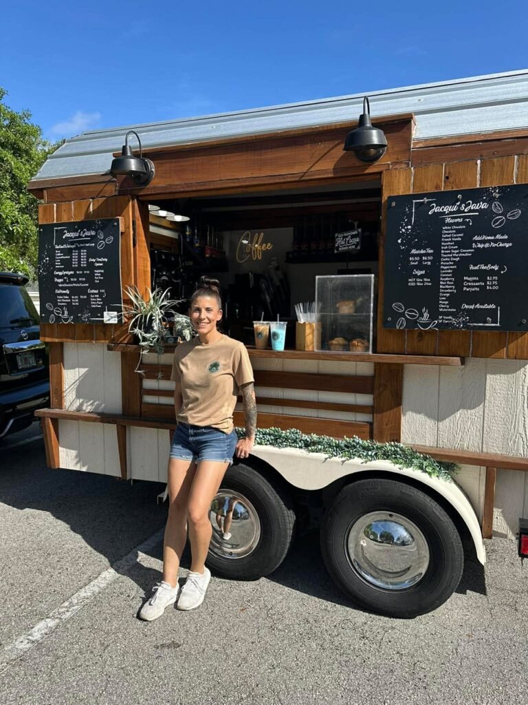 The Jacqui's Java mobile coffee trailer with chalkboard menus at a Clay County event
